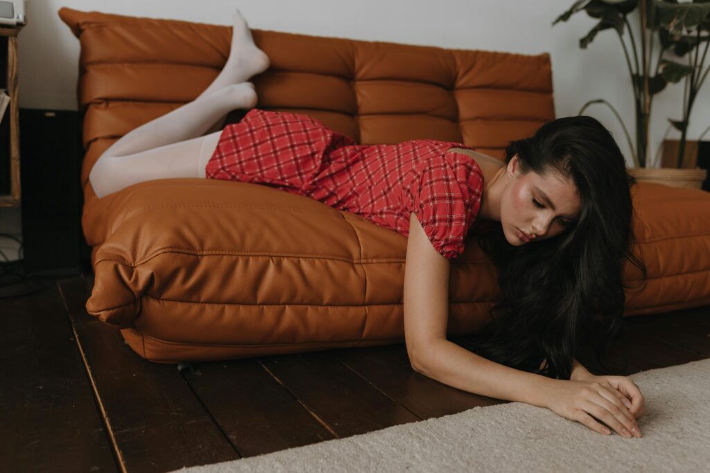 A female founder appears lost and uncertain, reflecting the frustration that comes from having no marketing strategy and seeing no results. The image illustrates the importance of clarity, direction, and intentional planning in business growth.